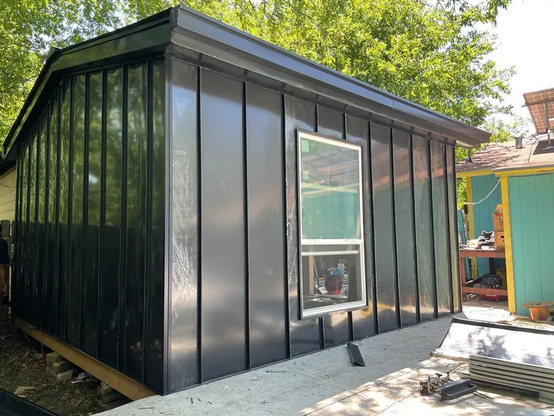 Black standing seam metal wall panels for Metal Roof Installation in North Dansville