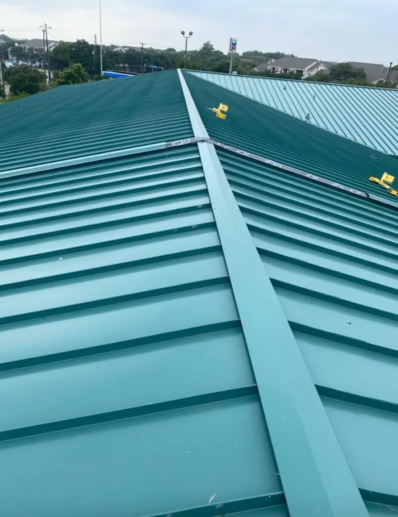 Green commercial metal roof ridge and valley for Metal Roof Repair in North Dansville
